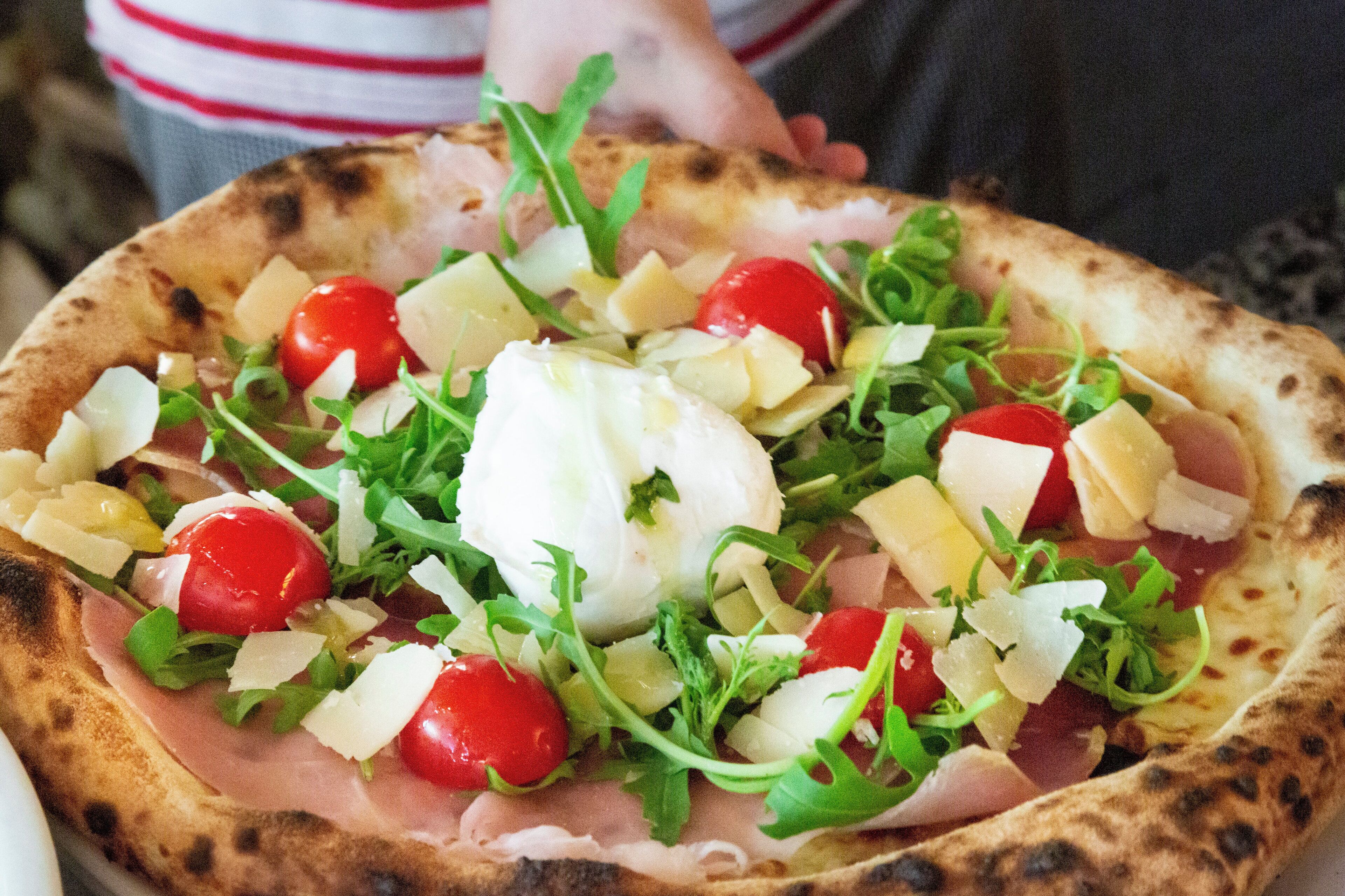 A pizza with various toppings.