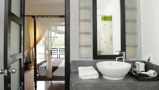 Deluxe Room, 1 King Bed, Balcony, Pool View | Bathroom sink - Amber Angkor Villa Hotel & Spa (Siem Reap)