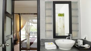 Deluxe Room, 1 King Bed, Balcony, Pool View | Bathroom sink