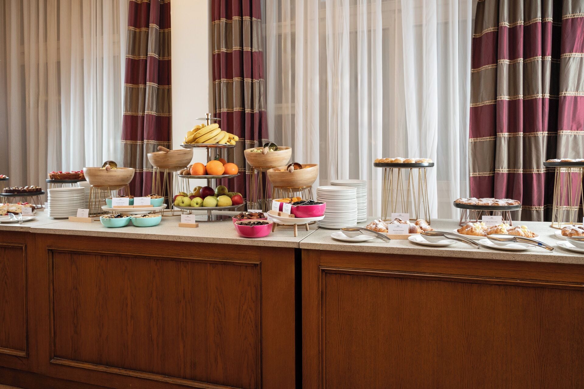 A buffet setup with various food items and serving dishes.