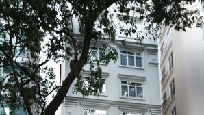 The exterior of the Aristotle Hotel with a modern facade, large windows, and a visible entrance with a staircase leading up to the entrance. - Aristo Saigon Hotel (HO CHI MINH CITY)