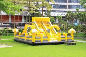 An inflatable play structure with slides and tunnels in a park area. - Crowne Plaza Guangzhou Huadu by IHG (Guangzhou)