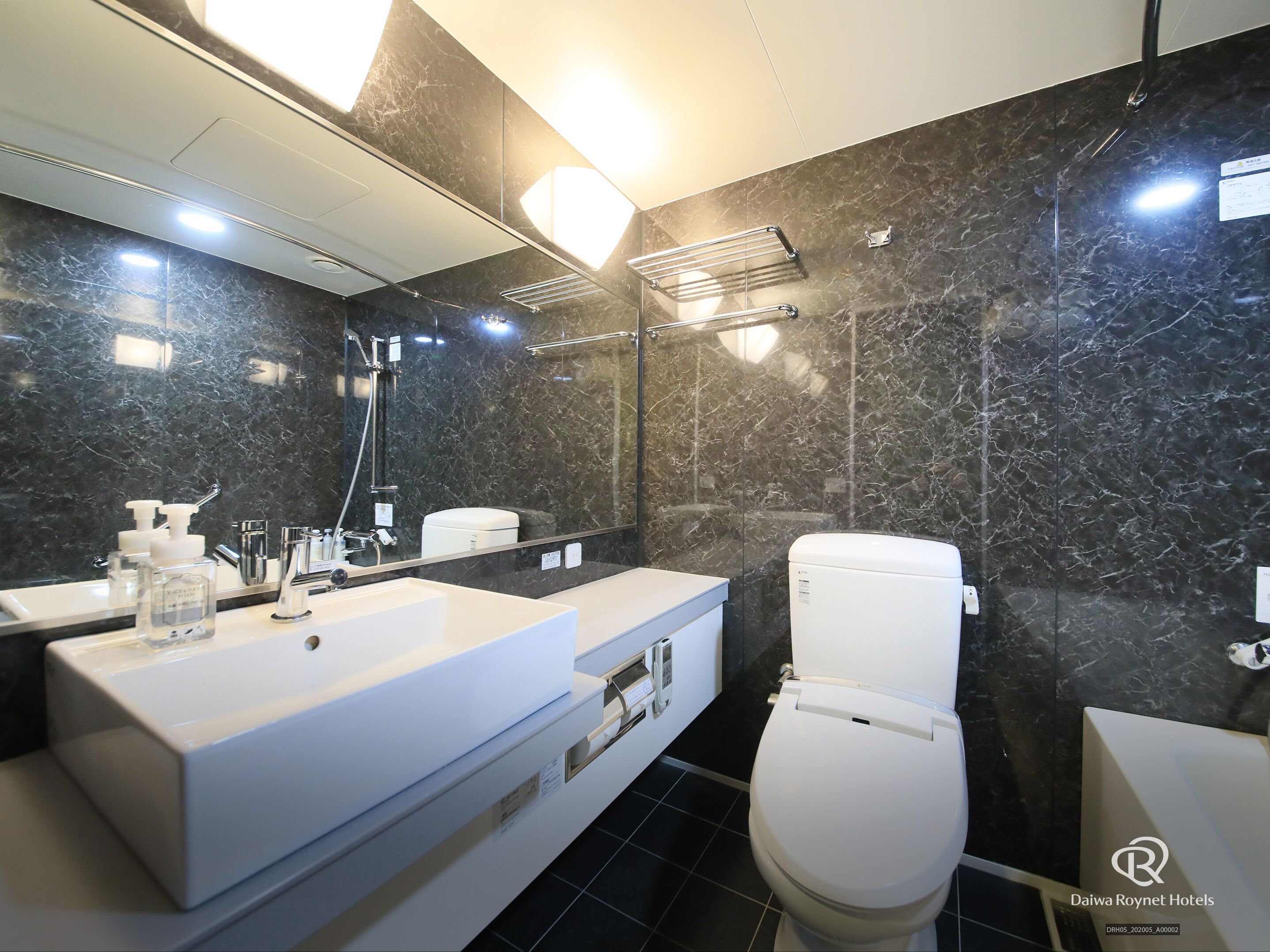 combined shower/bathtub, free toiletries, hair dryer, slippers