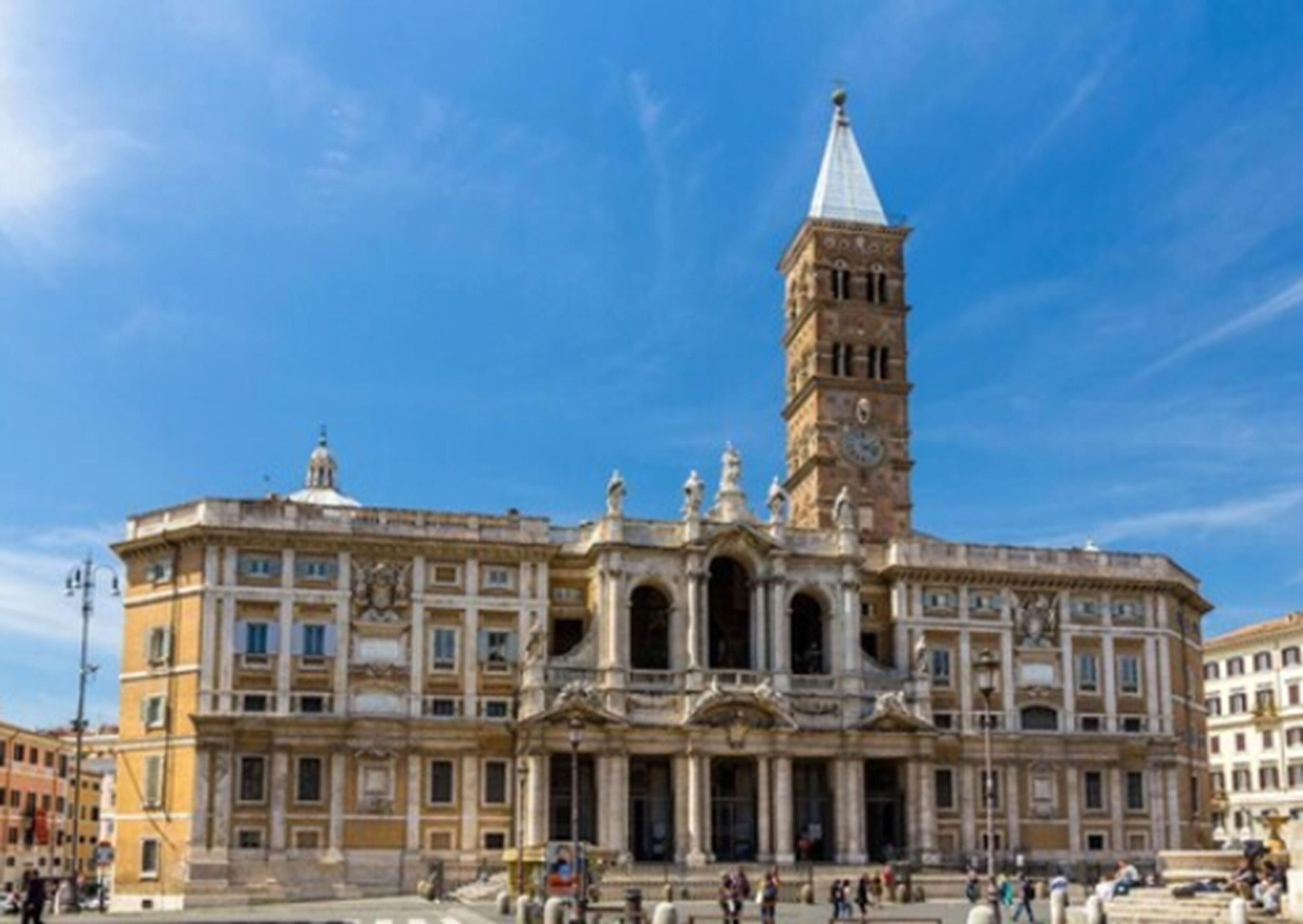 A historic building with a prominent tower and classical architecture.