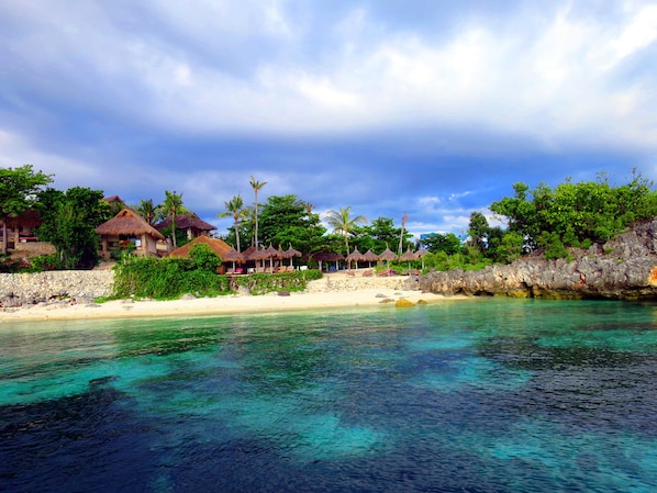 Private beach, white sand, sun loungers, beach umbrellas