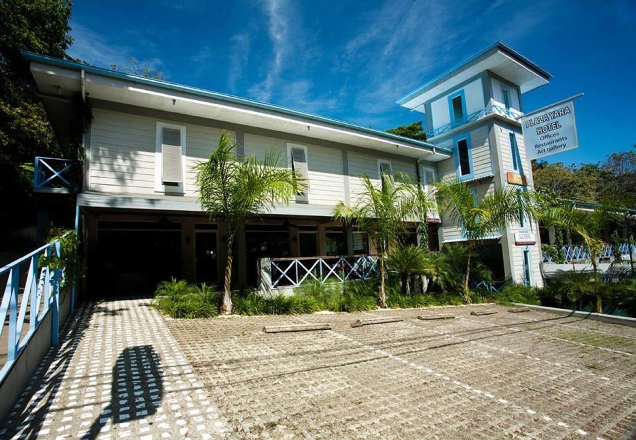 A two-story building with a sign indicating it is the Plaza Yara Hotel.
