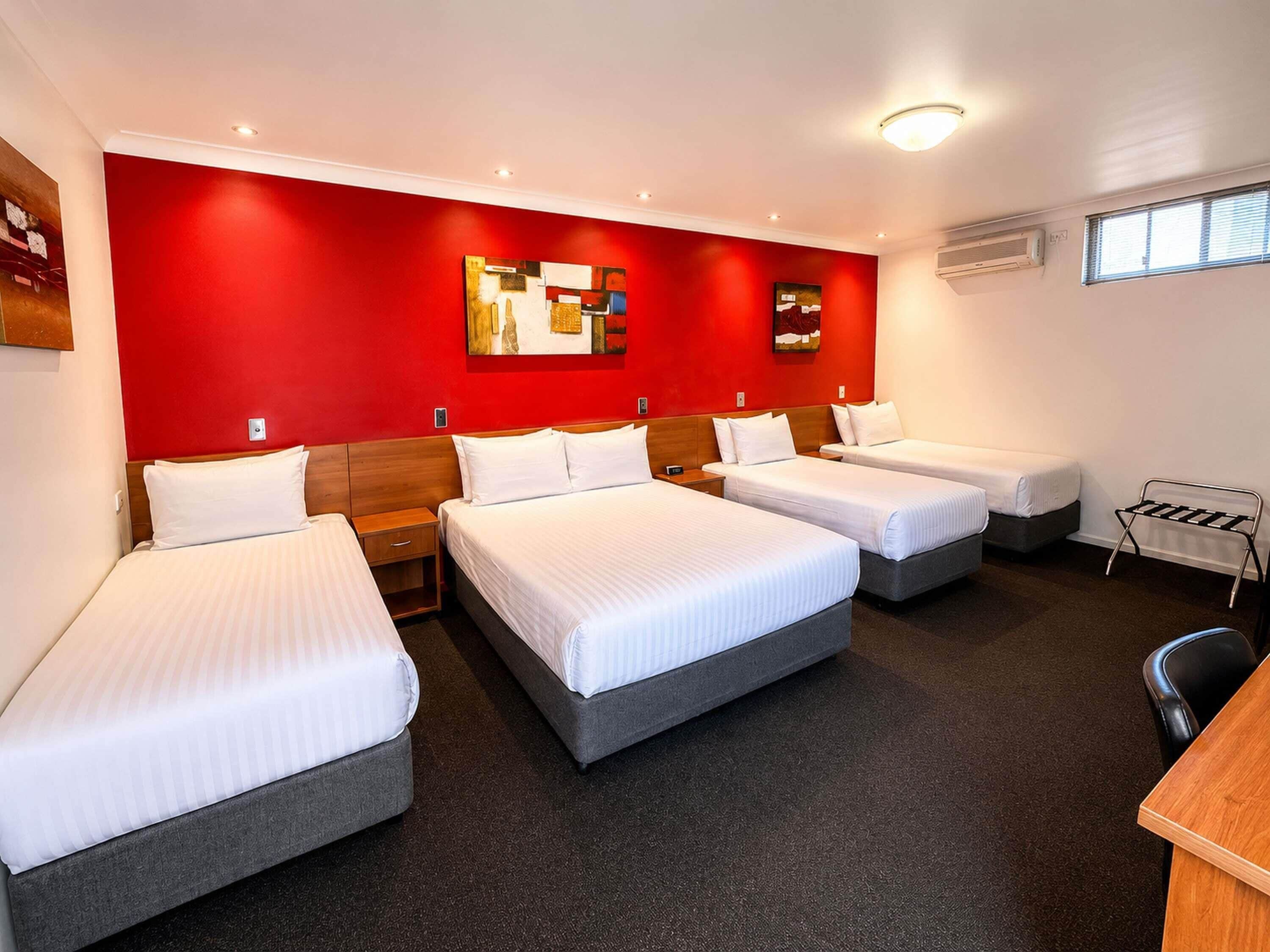 Family Room, Multiple Beds | Minibar, individually decorated, individually furnished, desk