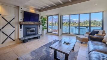 Executive Penthouse, 2 Bedrooms | Living area | 40-inch TV with satellite channels, fireplace