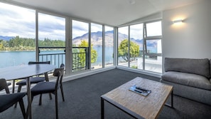 Penthouse 2 Bedroom 1 Bathroom Apartment | Living area | 40-inch TV with satellite channels, fireplace - The Waterfront (Queenstown)