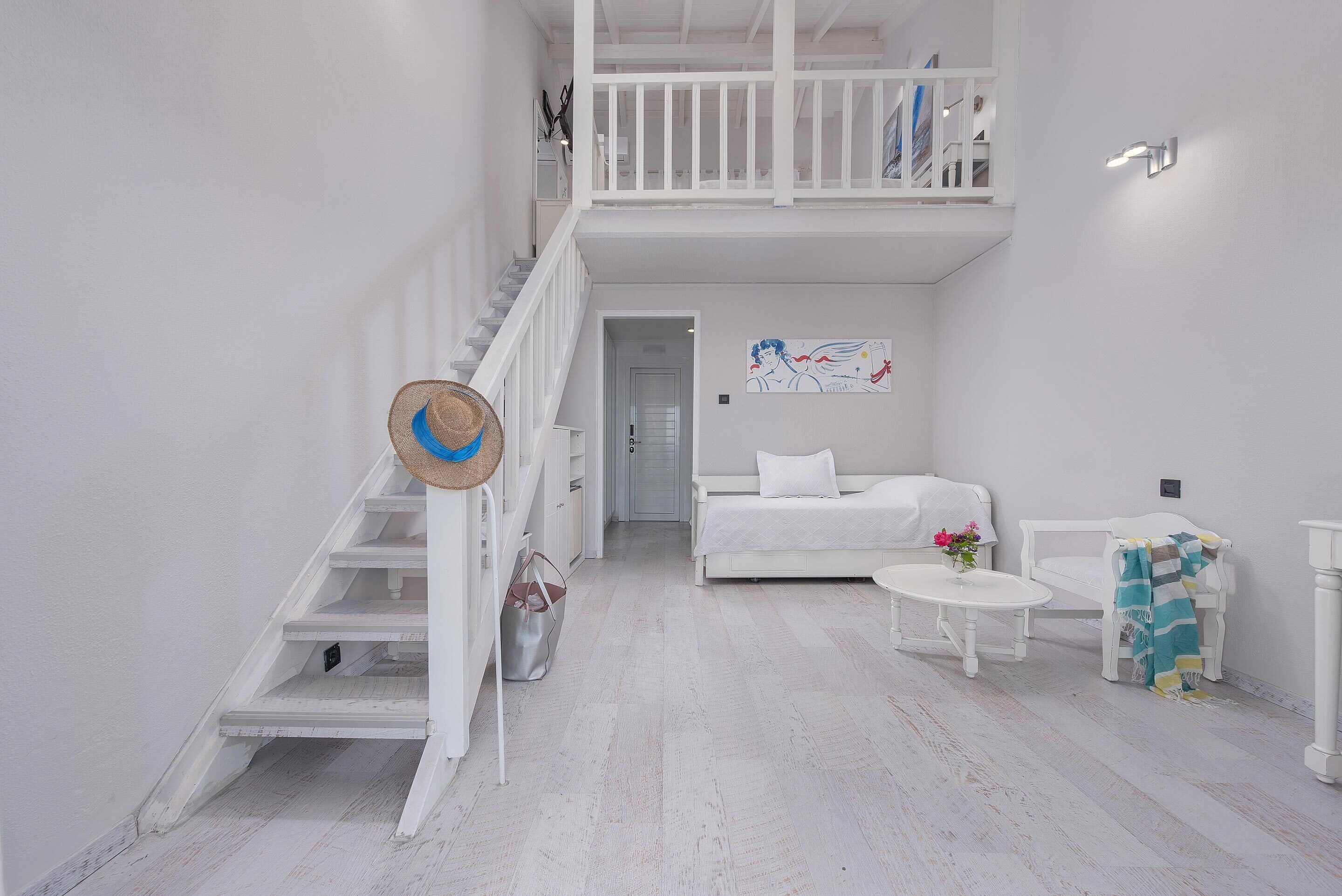 family room, partial sea view | living area | 32-inch tv with satellite channels