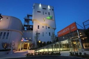 A modern building with a sign for 'ek' and 'eGarden' indicating a hotel or resort. - EKK Hotel (Citta Sant'Angelo)