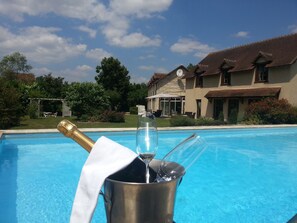 Outdoor pool, pool umbrellas, pool loungers