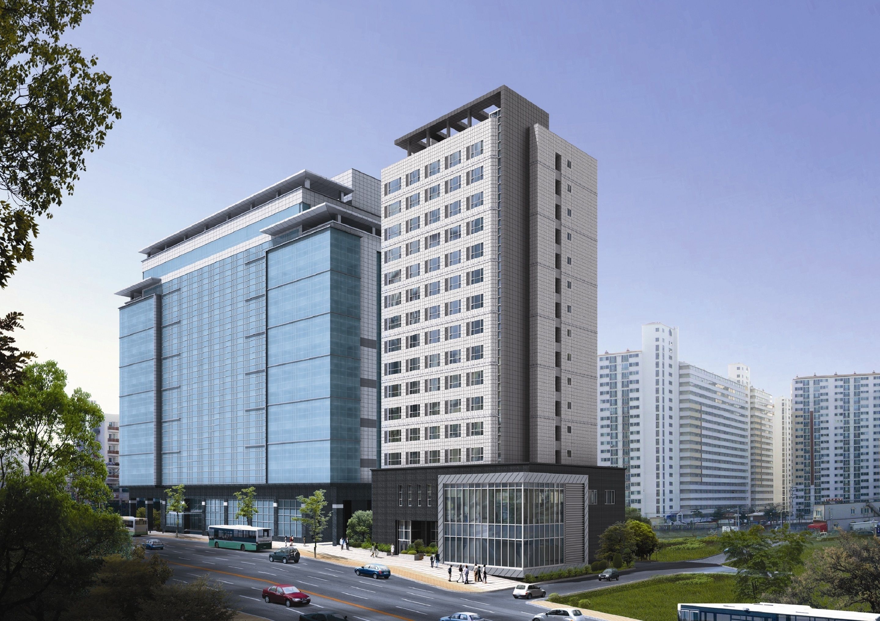 A modern multi-story building with large glass windows, a prominent entrance, and a parking area with cars and a bus.