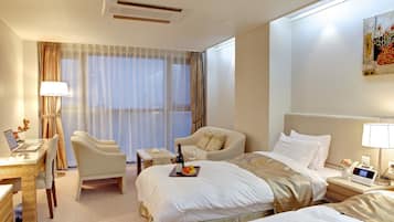 Deluxe Twin Room, Partial Ocean View | 1 bedroom, down comforters, desk, laptop workspace