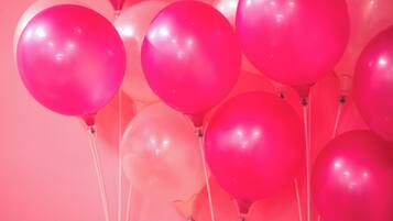 A cluster of balloons tied together.