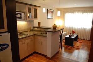 Fridge, microwave, espresso maker, cookware/dishes/utensils
