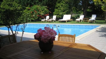 Seasonal outdoor pool, pool umbrellas, pool loungers