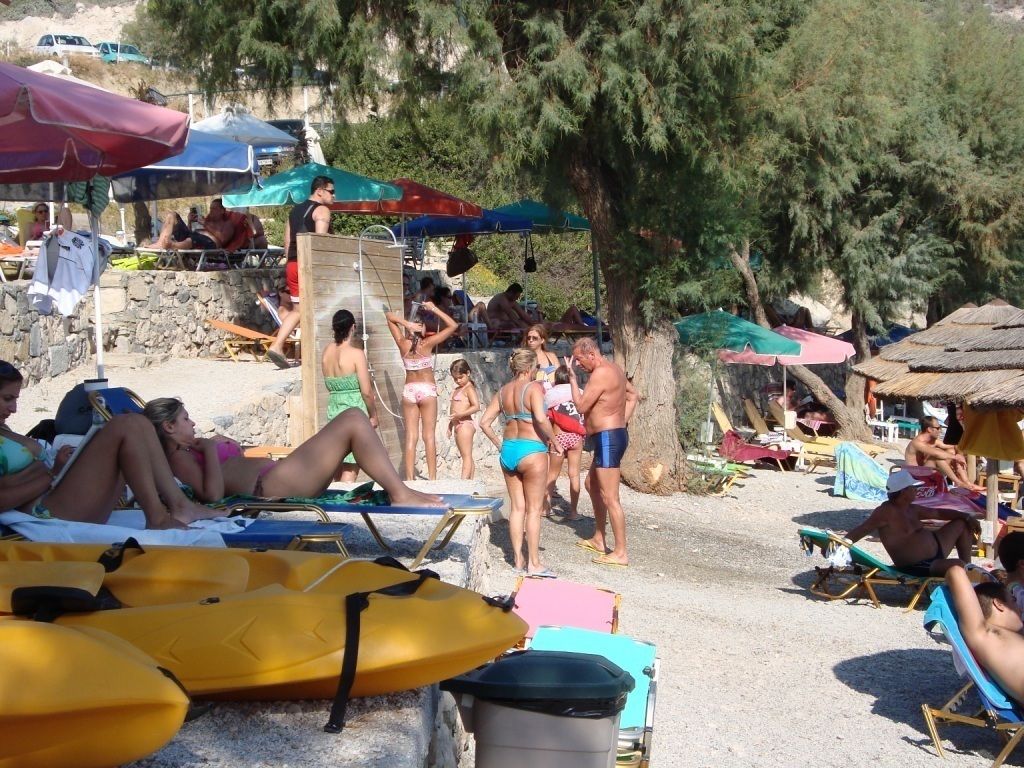on the beach, sun-loungers, beach umbrellas, beach towels