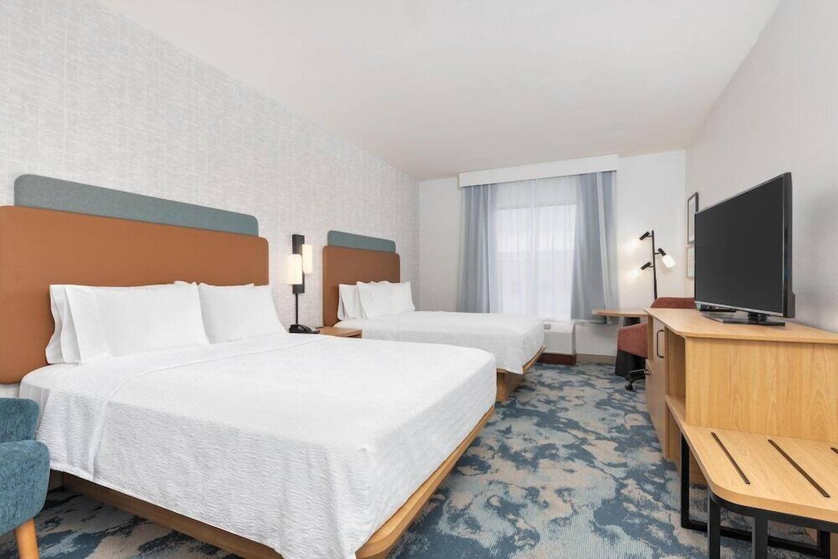 Blackout drapes, iron/ironing board, WiFi (free), alarm clocks