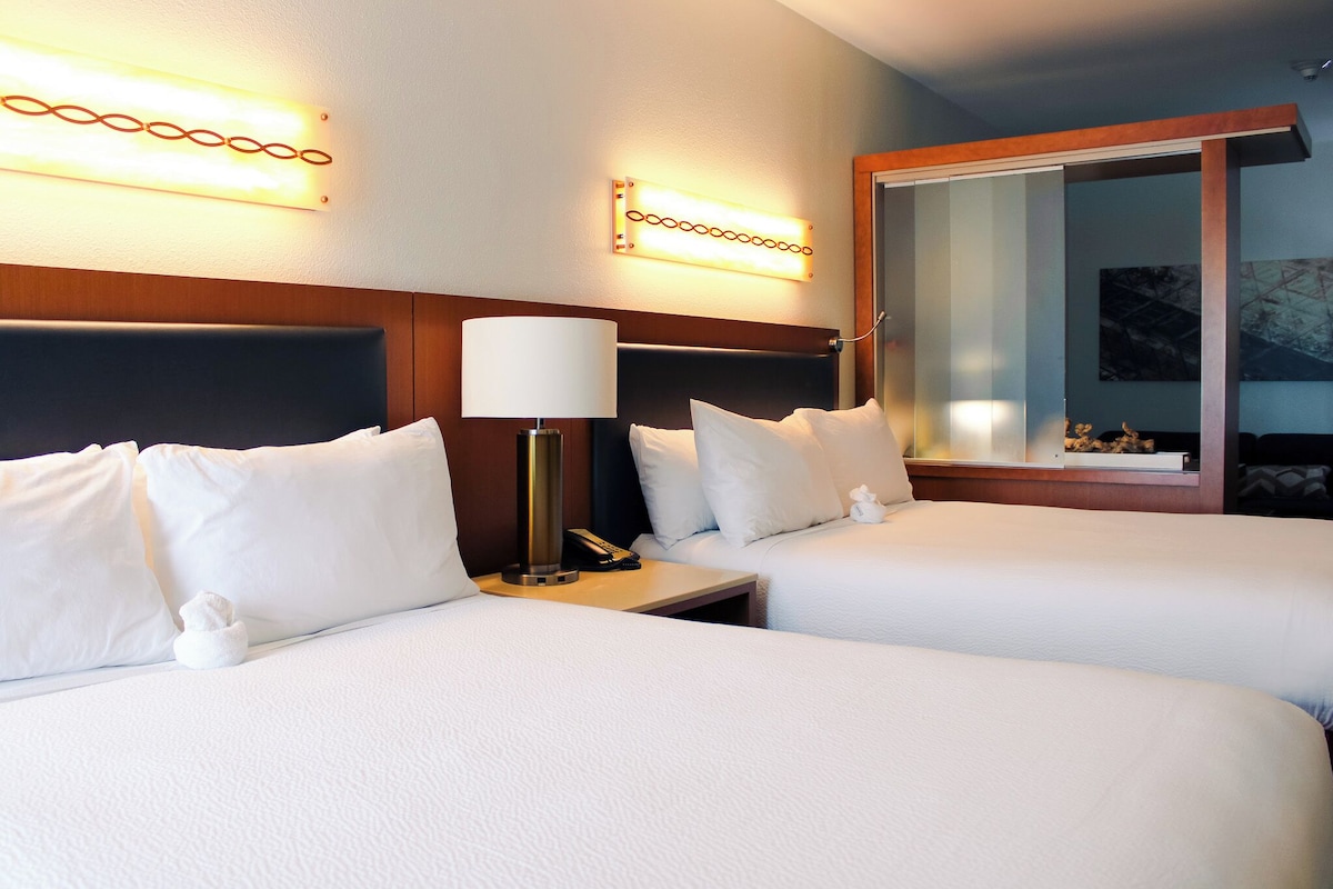 Premium bedding, desk, laptop workspace, blackout curtains