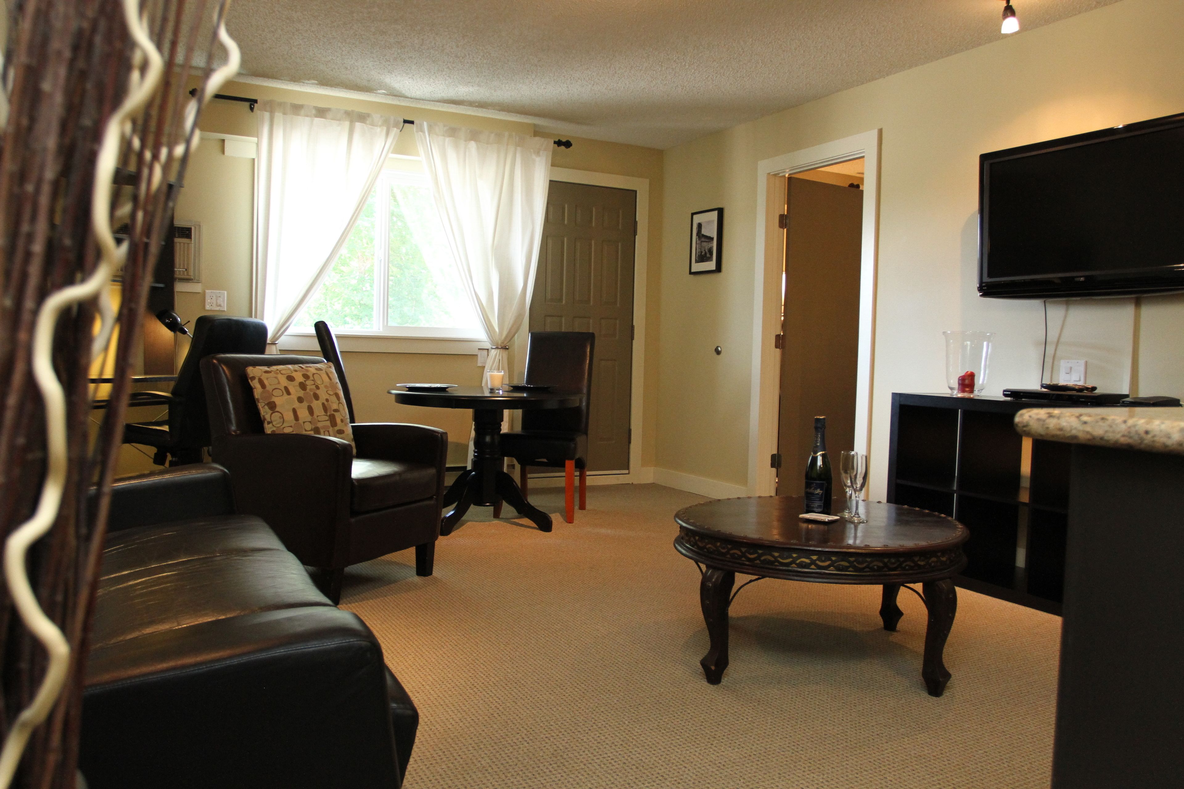 honeymoon suite, 1 king bed with sofa bed, balcony | living area | 37-inch flat-screen tv with cable channels, tv, dvd player