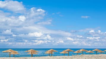Beach nearby, white sand, beach towels