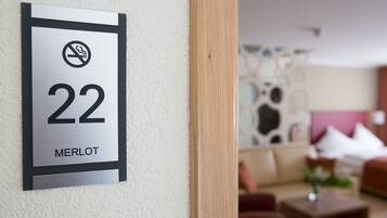 A hotel room number sign with a no-smoking symbol and the number 22.