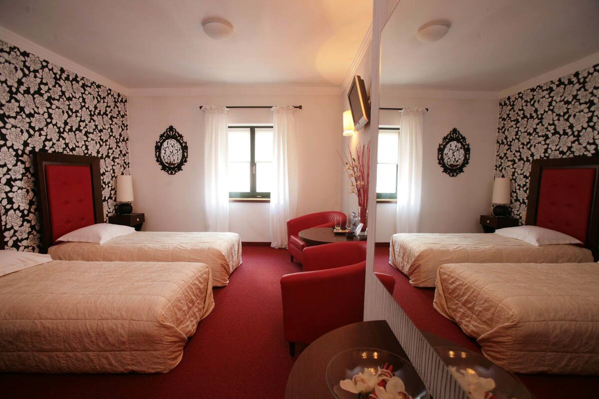In-room safe, blackout drapes, iron/ironing board, cribs (free)