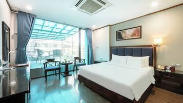 Suite Room | Minibar, in-room safe, blackout drapes, iron/ironing board