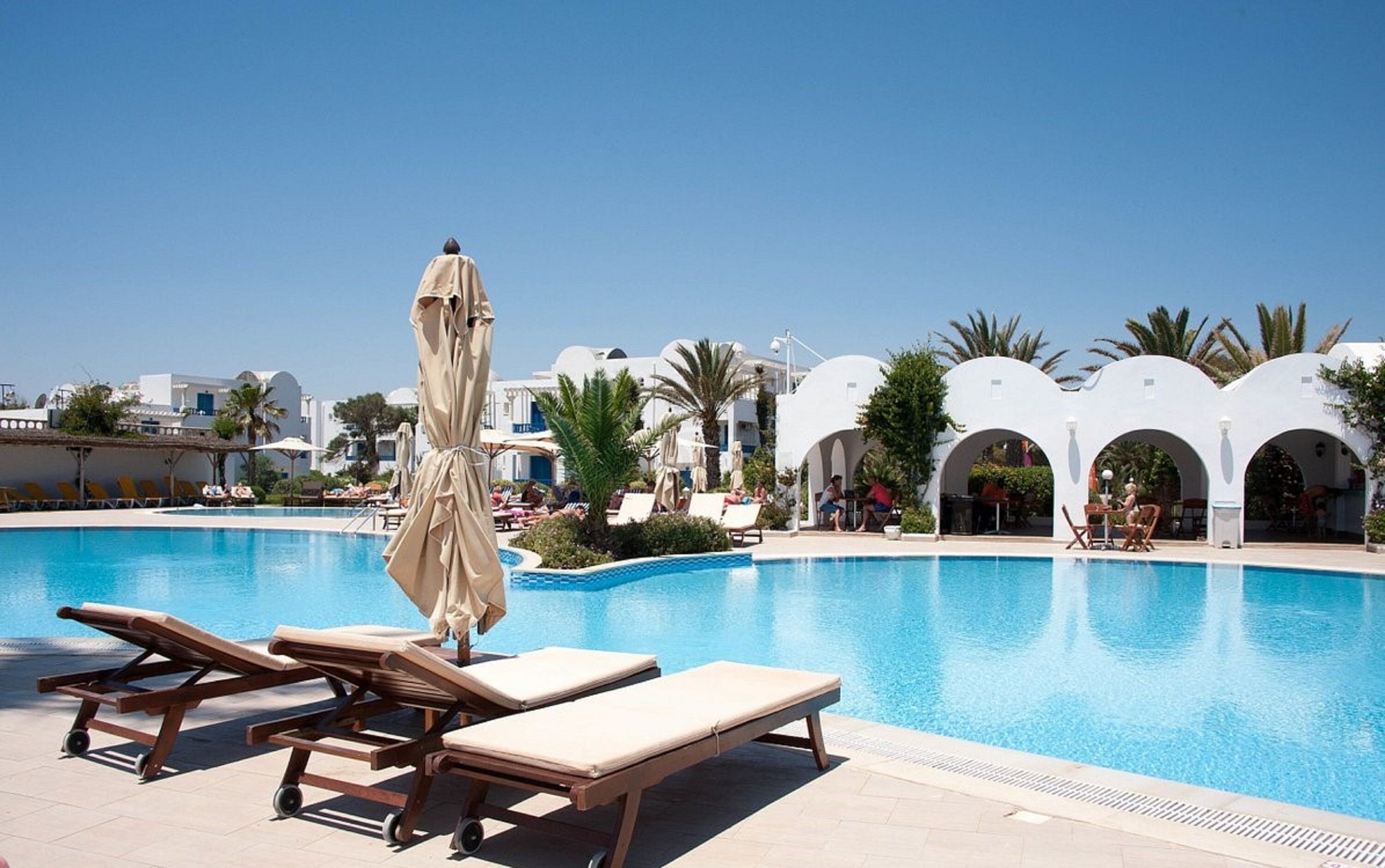 Indoor pool, outdoor pool, pool umbrellas, pool loungers