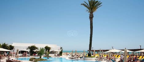 Indoor pool, outdoor pool, pool umbrellas, sun loungers