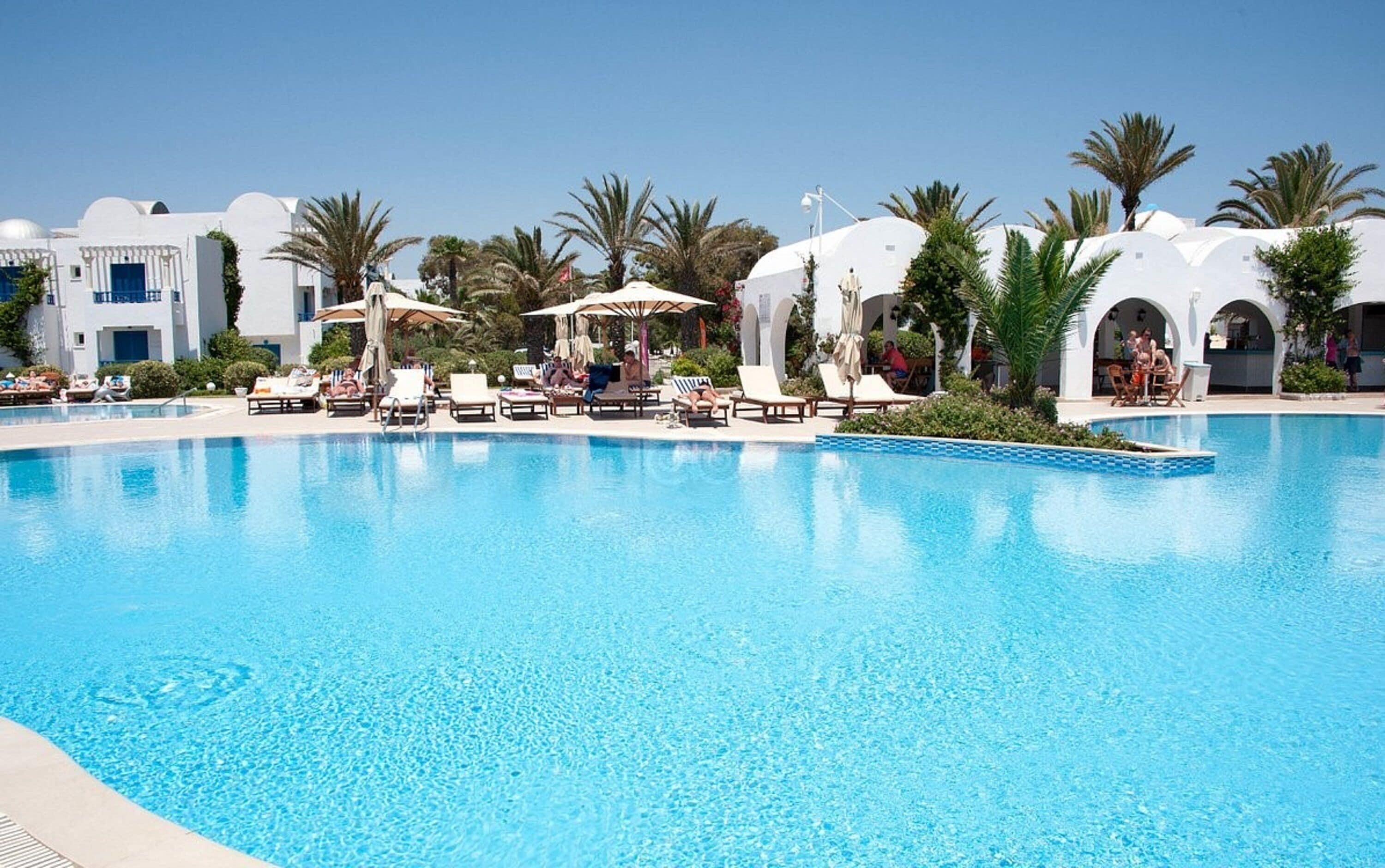 Indoor pool, outdoor pool, pool umbrellas, pool loungers