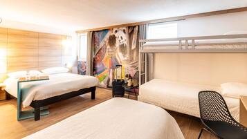 A hotel room with two beds, a mural, a window, and a chair.
