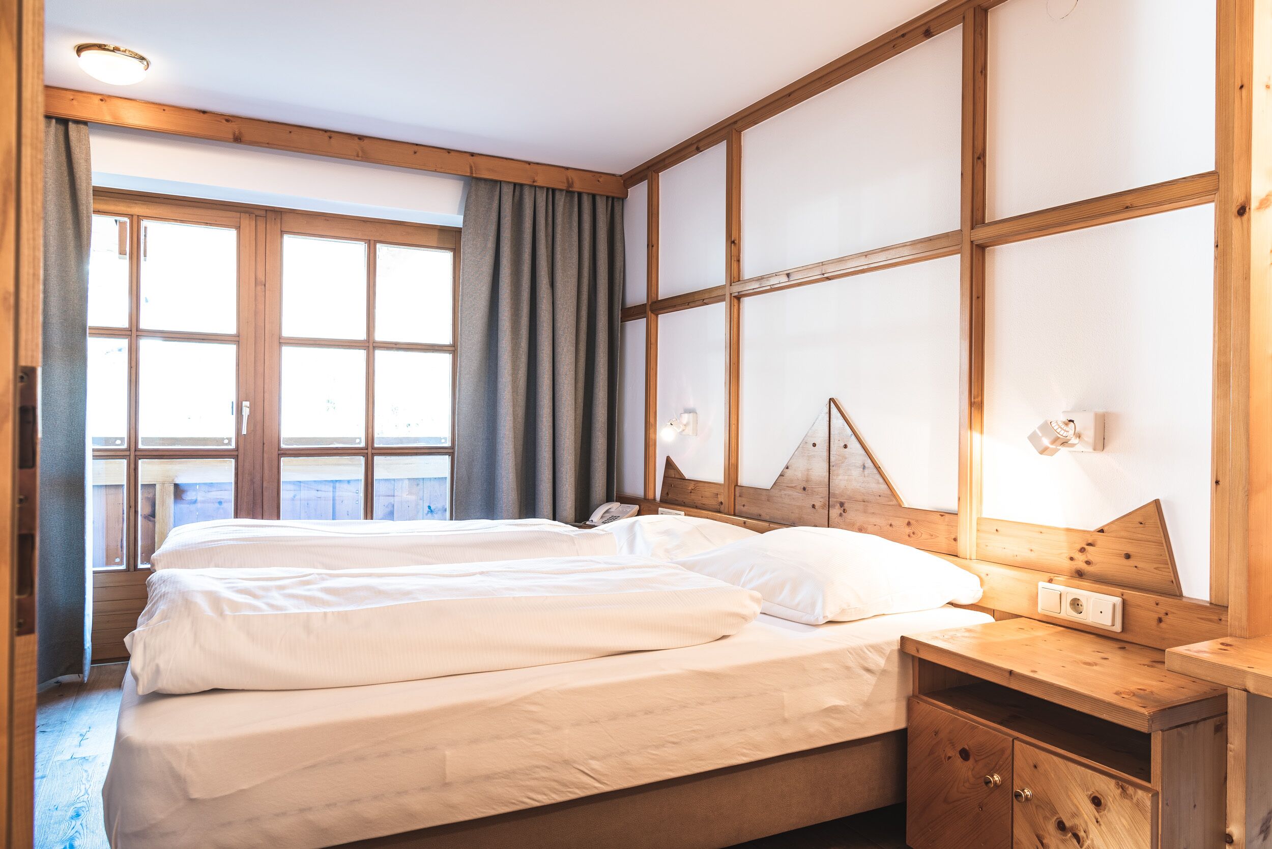 family suite, 2 bedrooms, balcony, mountain view | 2 bedrooms, in-room safe, individually decorated, individually furnished