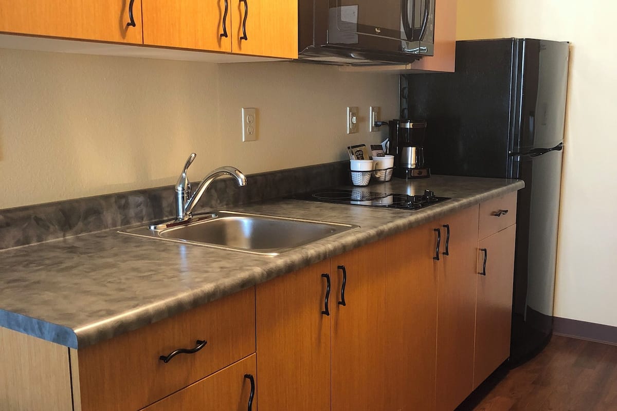 fridge, microwave, coffee/tea maker, cookware/dishes/utensils