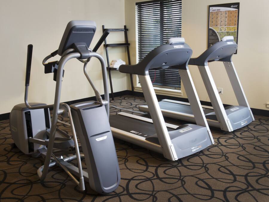 A fitness area with treadmills and a stationary bike.