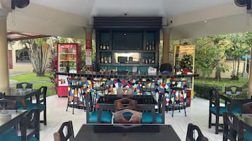 Breakfast, lunch served; local and international cuisine, pool views