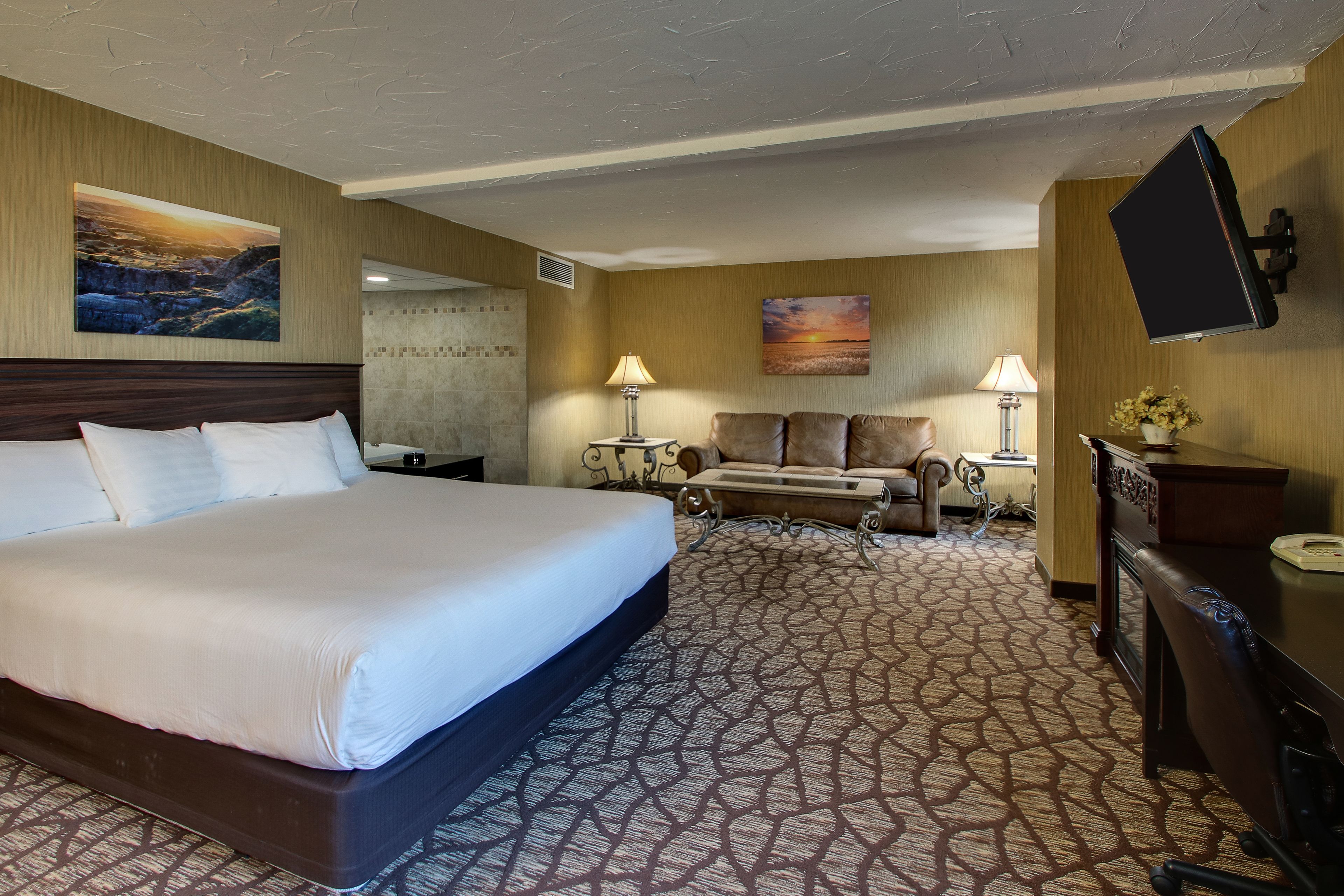 suite, jetted tub | desk, laptop workspace, blackout curtains, iron/ironing board