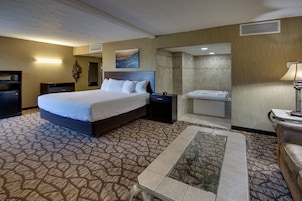 Suite, Jetted Tub | Desk, laptop workspace, blackout drapes, iron/ironing board
