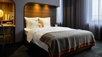 Premium bedding, down comforters, free minibar, in-room safe