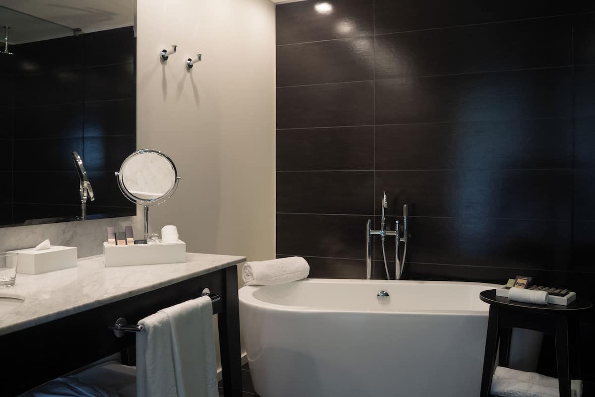 room, 1 king bed (the singular) | bathroom | free toiletries, hair dryer, bathrobes, heated floors