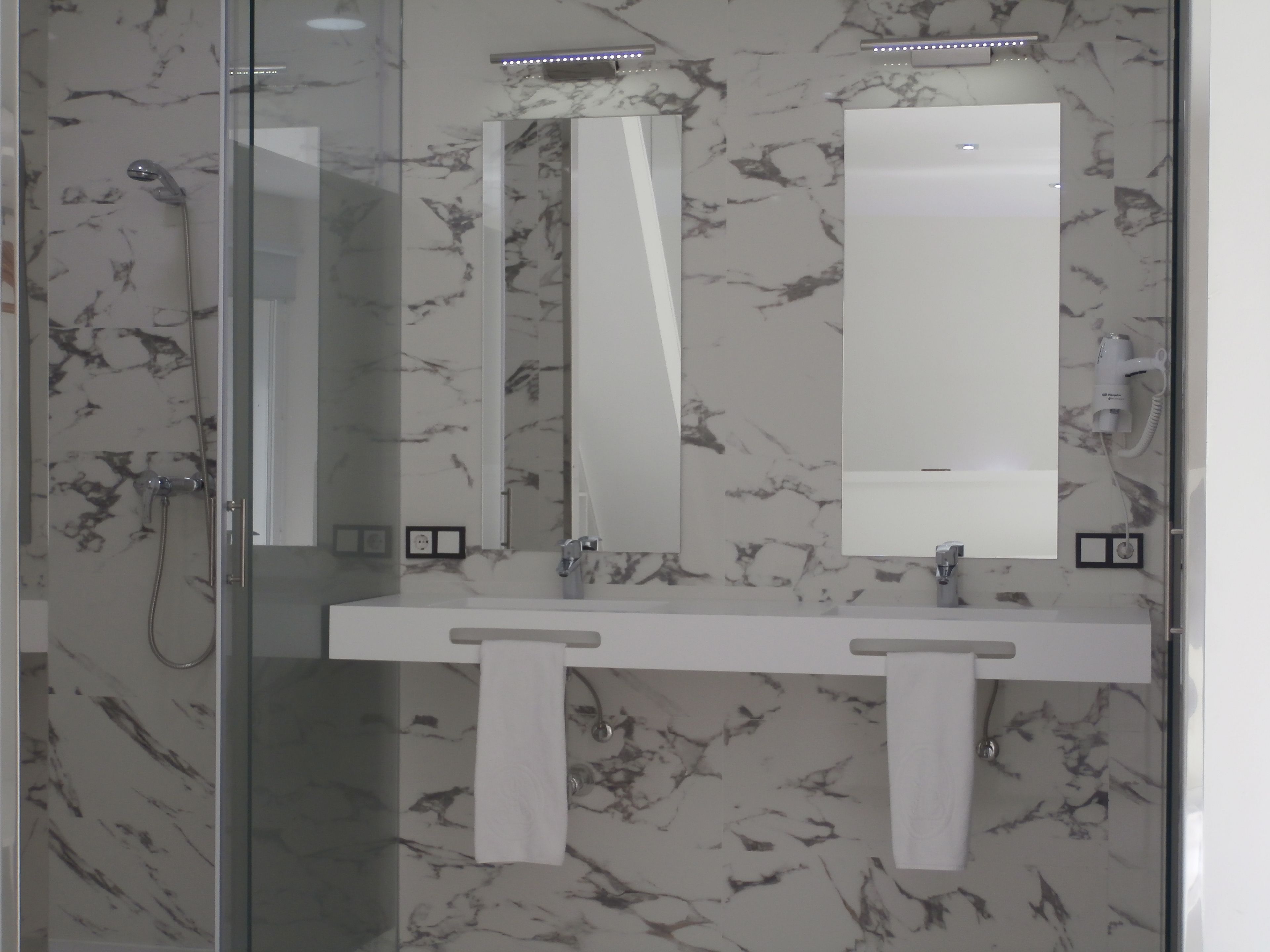 apartment, 1 bedroom, city view | bathroom | free toiletries, hair dryer, towels