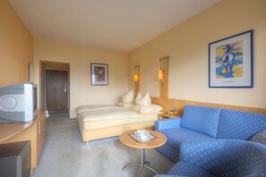 Luxe beddengoed, een minibar, een kluis op de kamer, een bureau