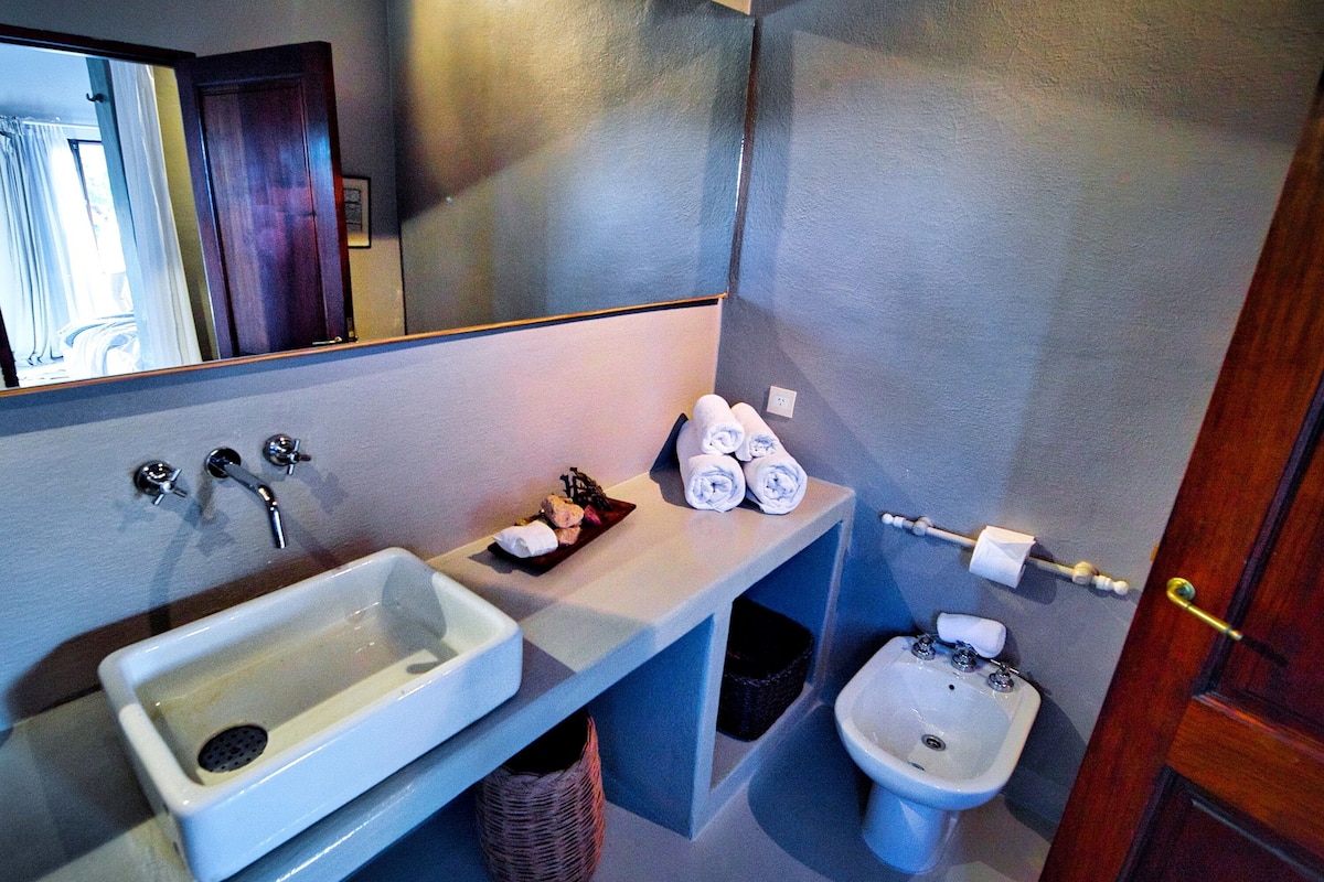 deluxe double room | bathroom | designer toiletries, hair dryer, bidet, towels