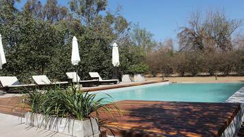 Outdoor pool, pool umbrellas, sun loungers
