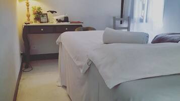 Cozy retreat with a single bed, desk, and framed picture, perfect for a relaxing stay.