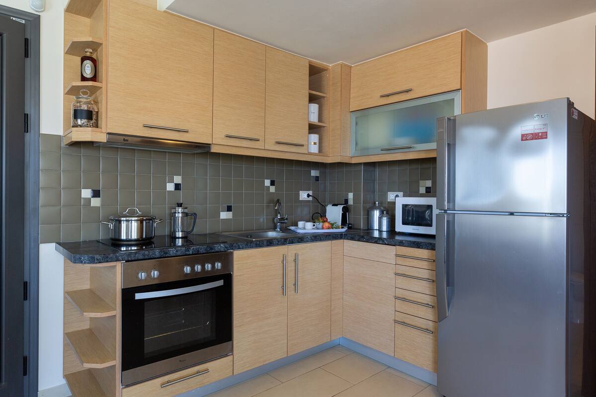 deluxe apartment, private pool (dimitra) | private kitchen | full-sized fridge, microwave, oven, stovetop