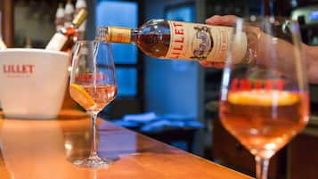 A bottle of Lillet being poured into a glass.
