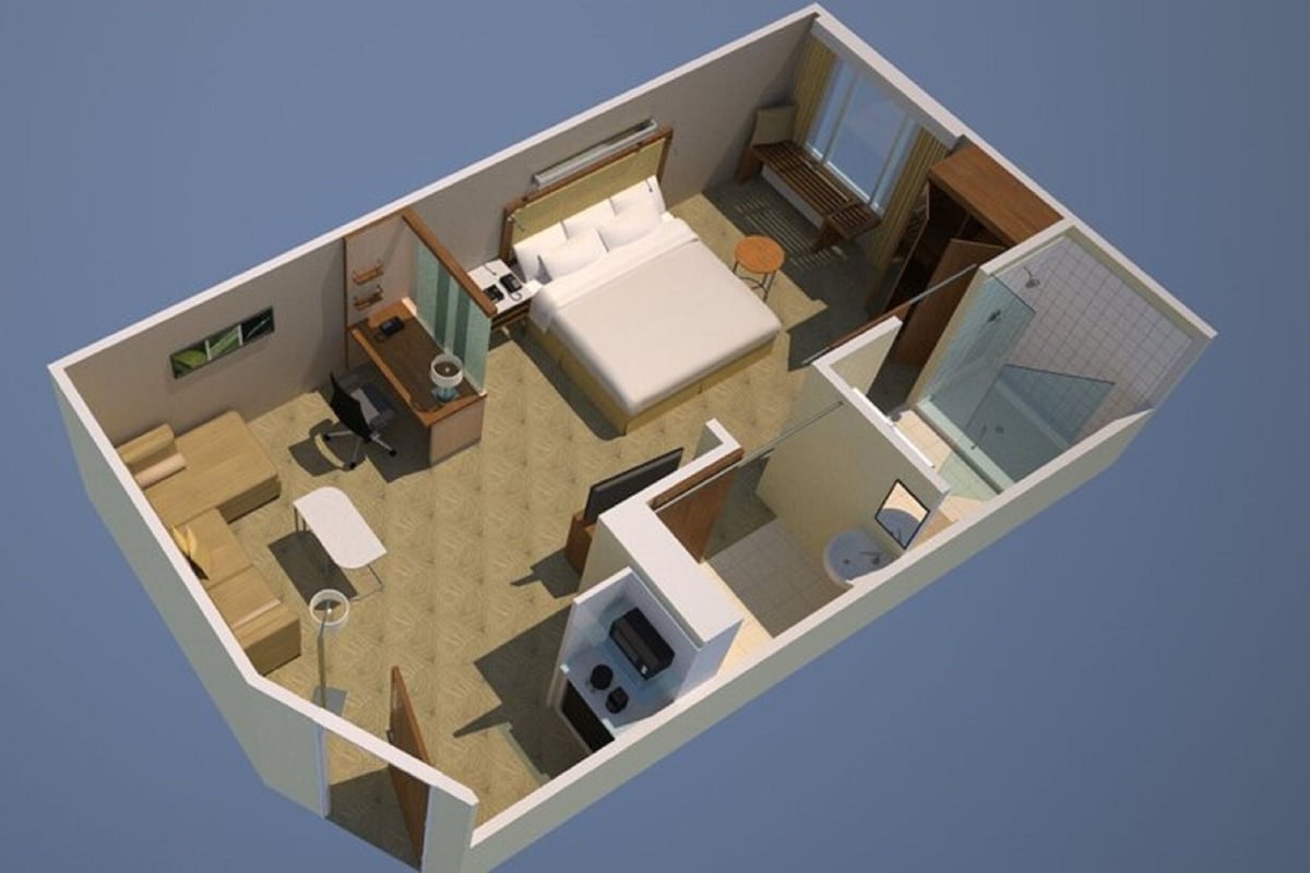 A 3D rendering of a hotel room with a bed, desk, chair, and a small bathroom.