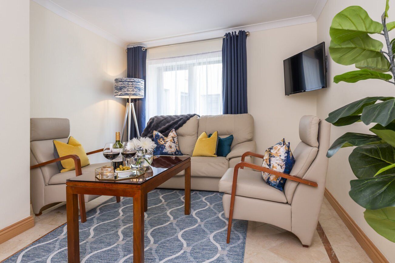 Standard Apartment, 2 Bedrooms | Living area | 32-inch TV with cable channels, DVD player